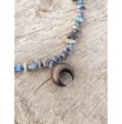 Beautiful choker made of glass beads with a wooden clover